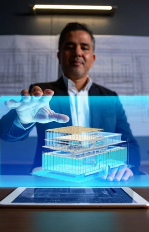 A construction professional interacting with a glowing 3D holographic building model projected from a tablet, representing the advanced technology used by our shop drawing company in Rhode Island.